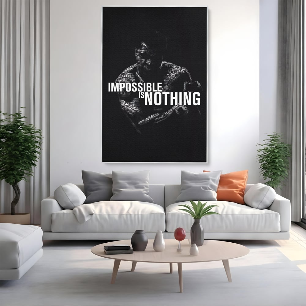 Tablou canvas cu tablou canvas cu silueta masculina si text motivational, in rama de aluminiu argintiu, pe perete intr-un living